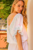 white cotton bloused designer beach dress, low v back  to wear on holiday by lindsey brown resort wear 