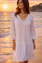 white v neck soft cotton beach dress to wear on a caribbean holiday
