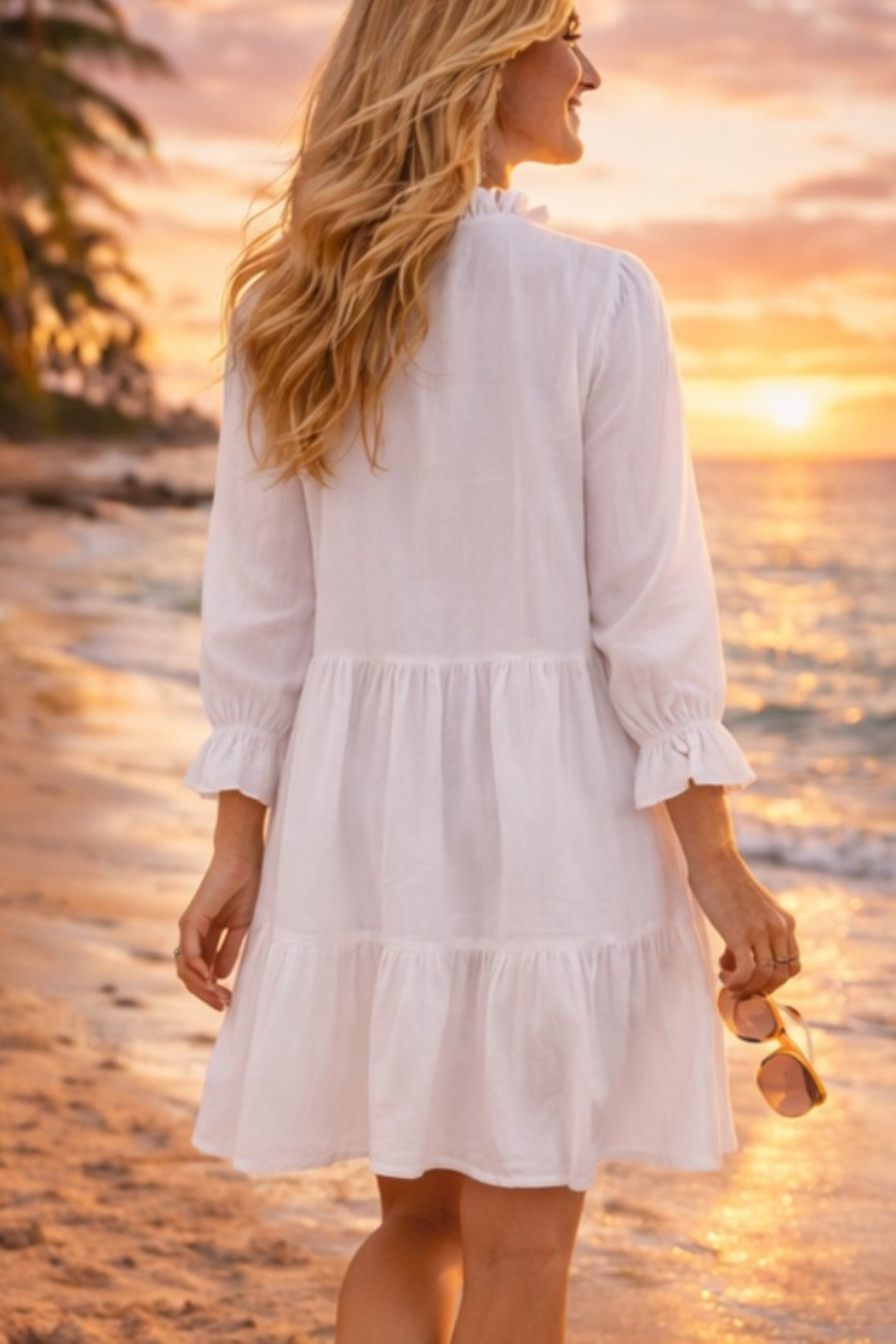 white cotton long sleeved  holidays dresses to wear to the beach