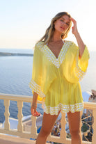 yellow and white short silk designer kaftans to wear on holiday in Santorini by lindsey brown resort wear 