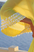 lemon yellow silk short designer kaftan to wear on holiday by Lindsey Brown luxury resort wear 