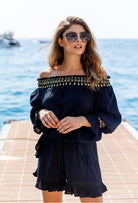 Black bardot off the shoulder holiday top by Lindsey Brown resort wear