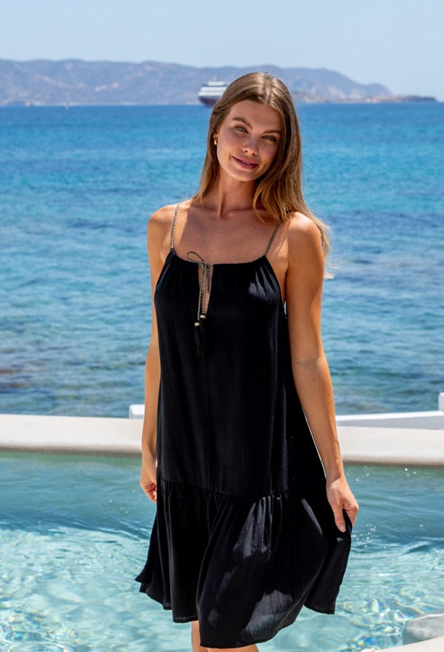Black sleeveless cotton beach dress to wear on holiday by lindsey brown resort wear 