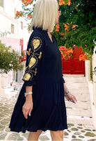 Black and gold smock style dress by Lindsey Brown resort wear 