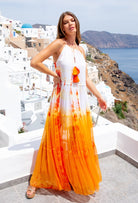 Stunning silk maxi dresses to wear in Santorini , orange silk designer holiday dress by lindsey brown resort wear 