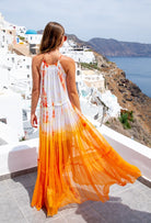 Floaty silk resort wear in beautiful bright orange silk luxury resort wear dresses  by lindsey brown resort wear 