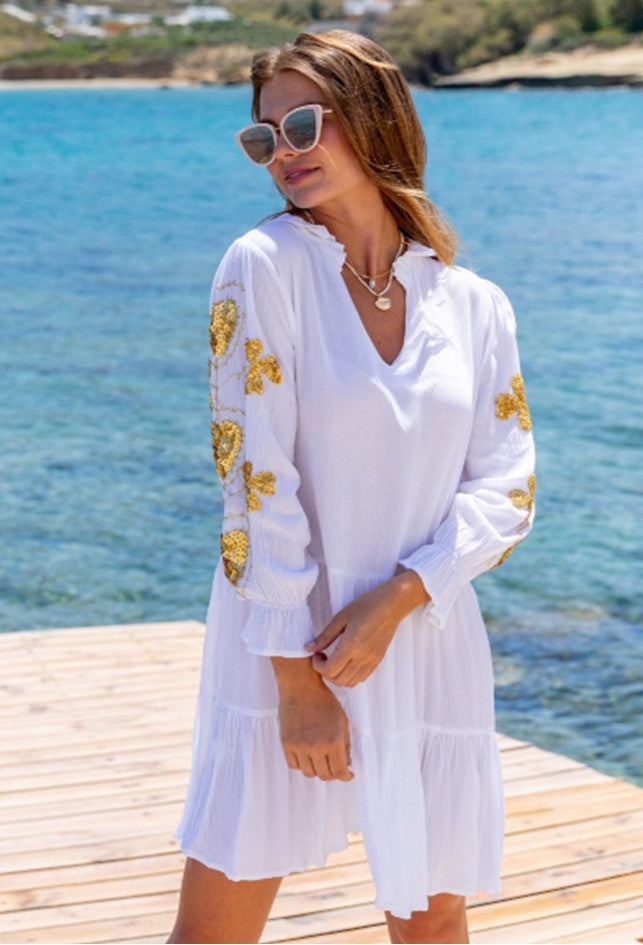 white gold smock style beach dress to wear on holiday by lindsey brown resort wear 